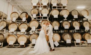 Couple in Barrel Room. Photo Credit: Kate Donovan Photography