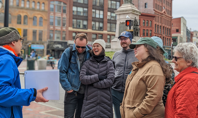 Portland by the Foot Tour Group in Monument Square Maine. Photo Credit: Dela Murphy