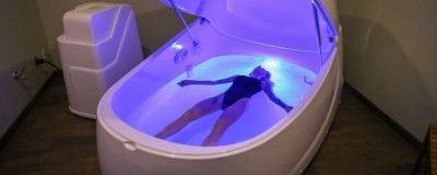 Person laying in tub. Photo Provided by Float Harder Relaxation Center