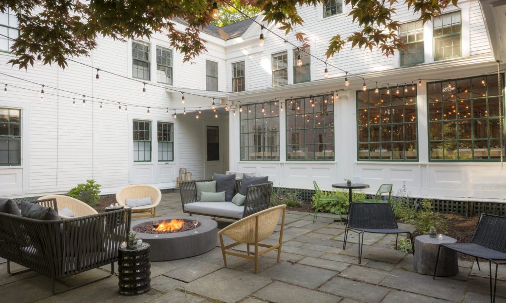 Outdoor patio with a firepit and seating area. Photo Credit: Rarebrick Photography Outdoor patio with a firepit and seating area. Photo Credit: Rarebrick Photography