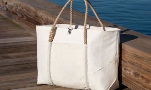 White Sea Bag in Front of Water. Photo Credit: Sea Bags