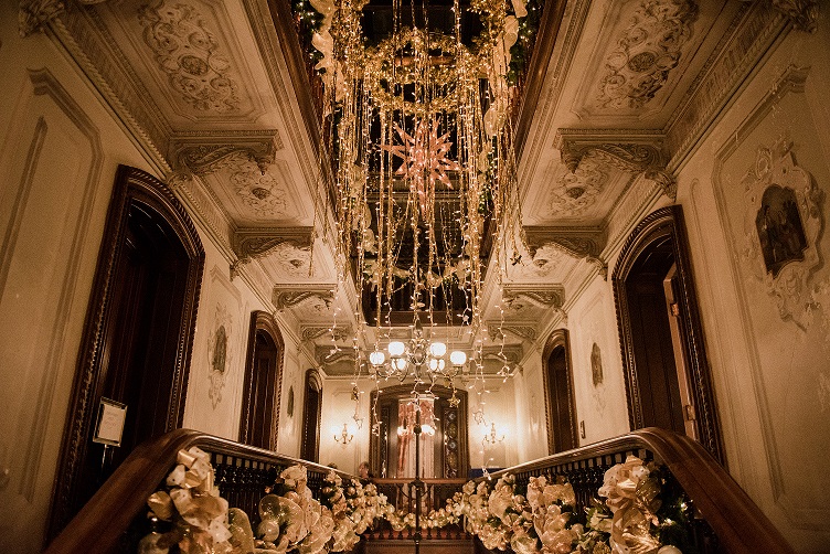 Stair Hall in Victoria Mansion decorated for holiday season, photo by Courtney Vamvakias
