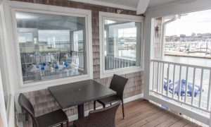 outdoor balcony on Seawatch room, Photo Credits: Saltwater Grille