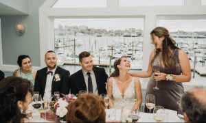 wedding party at dinner table - photo by The Camerados