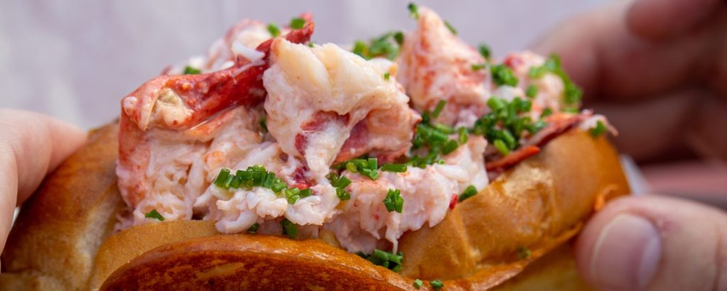 Bite into Maine Lobster rolls, Photo Credits: Serena Folding Bite into Maine Lobster rolls, Photo Credits: Serena Folding