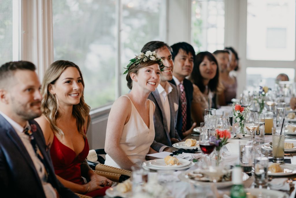 A wedding party sitting in the private dining room. Photo Credit: Leah Fisher Photography