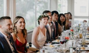 A wedding party sitting in the private dining room. Photo Credit: Leah Fisher Photography