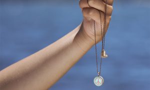 Hand with Bronze Heart Charm and Peace Sign, photo Provided by Chart Metalworks