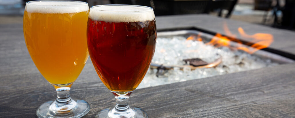 Beers by Outdoor Firepit. Photo Credit: Serena Folding Photography