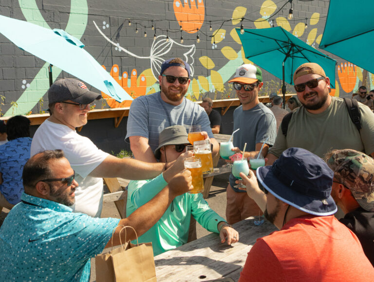 People Cheers-ing at Belleflower Brewing Co. Photo provided by Belleflower Brewing Co.