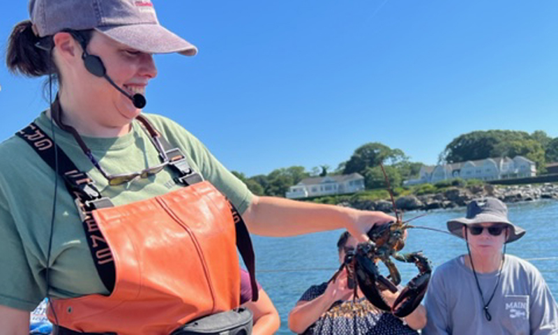 Lauren with Lobster. Photo Provided by Rugosa Lobster Tours