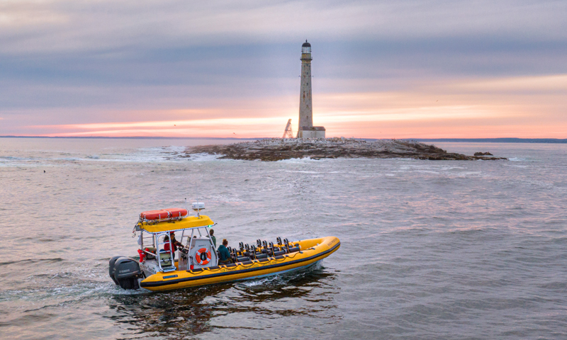 Tour Boat Passing Lighthouse Photo Provided by New England Eco Adventures