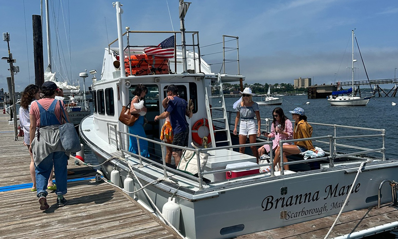 Group Getting on Boat. Photo Credit: Owen Johnson