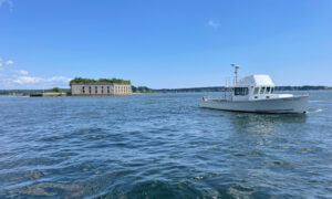 Boat Cruising over Casco Bay. Photo Credit: Owen Johnson