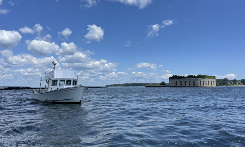 Boat Cruising over Casco Bay. Photo Credit: Owen Johnson