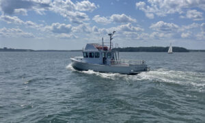 Boat Cruising over Casco Bay. Photo Credit: Owen Johnson