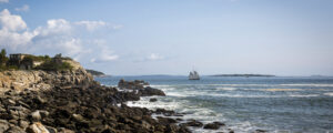 Sailboat off rocky coast Photo Credits: Serena Folding