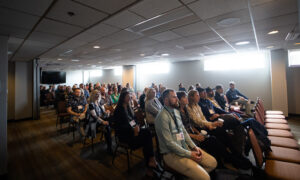 Listening to presentation, Photo Credit: Focus Photography