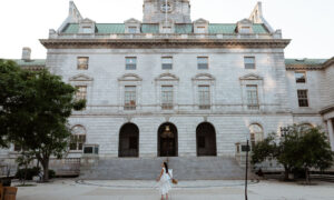 Woman at city hall listing. Photo Courtesy of @MarriottBonvoy