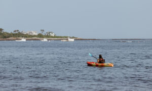 Woman kayaking listing. Photo Courtesy of @MarriottBonvoy