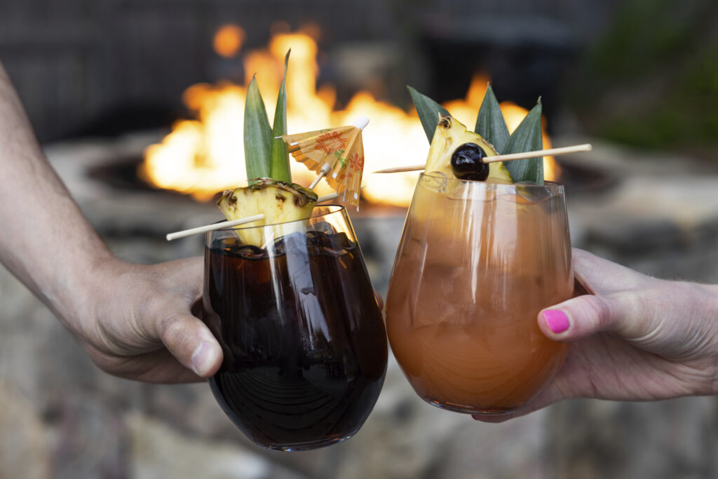 Mixed drinks in front of a fire, Photo Credit: Justin Smulski