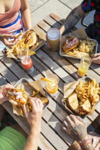 Outdoor dining with lobster + drinks, Photo Credit: Justin Smulski