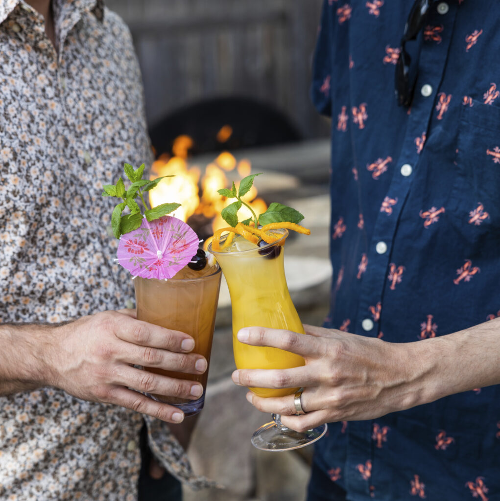 Mixed drinks in front of a fire, Photo Credit: Uncommon Groups