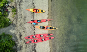 Kayaks on the beach, Photo credit: Lone Spruce Creative, courtesy of Maine Office of Tourism
