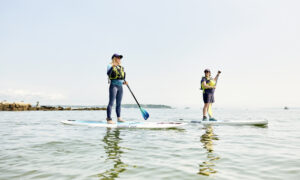 Paddle boarding duo, Photo credit: Lone Spruce Creative, courtesy of Maine Office of Tourism