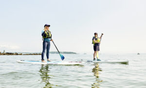 Paddle boarding duo, Photo credit: Lone Spruce Creative, courtesy of Maine Office of Tourism