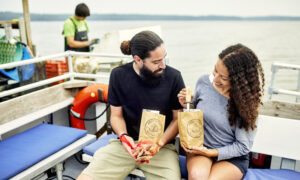 Couple with oyster shucking kit, Photo credit: Lone Spruce Creative, courtesy of Maine Office of Tourism