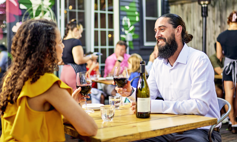 Couple drinking wine, Photo credit: Lone Spruce Creative, courtesy of Maine Office of Tourism