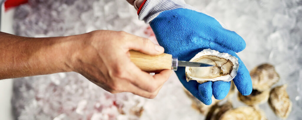 Oyster Shucking. Photo credit: Lone Spruce Creative, courtesy of Maine Office of Tourism