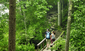 Couple Hiking on bridge, Photo credit: Lone Spruce Creative, courtesy of Maine Office of Tourism