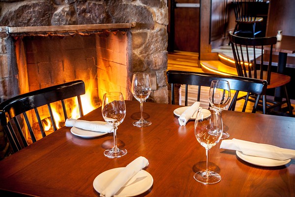 Dining by Fireplace, Photo Credit: Boone's Fish House & Oyster Room