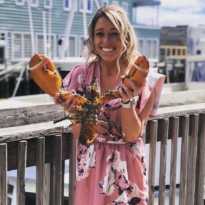 Girl with Lobster. Photo Credit: Boone's Fish House & Oyster Room