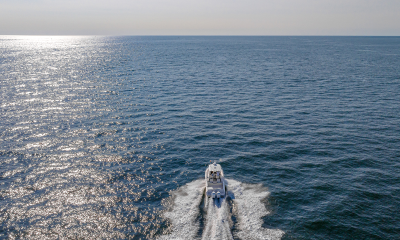 Fore River Sports Fishing cruising on water, Photo Credit: PGM Photography