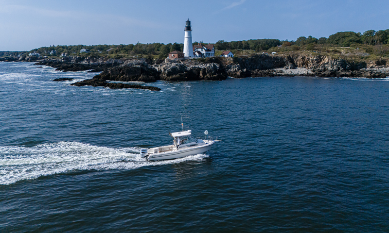 Fore River Sports Fishing cruising on water, Photo Credit: PGM Photography