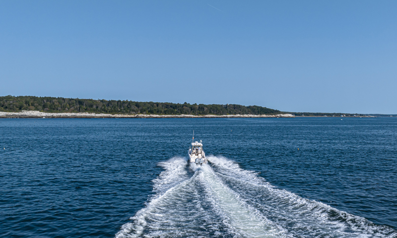 Fore River Sports Fishing cruising on water, Photo Credit: PGM Photography