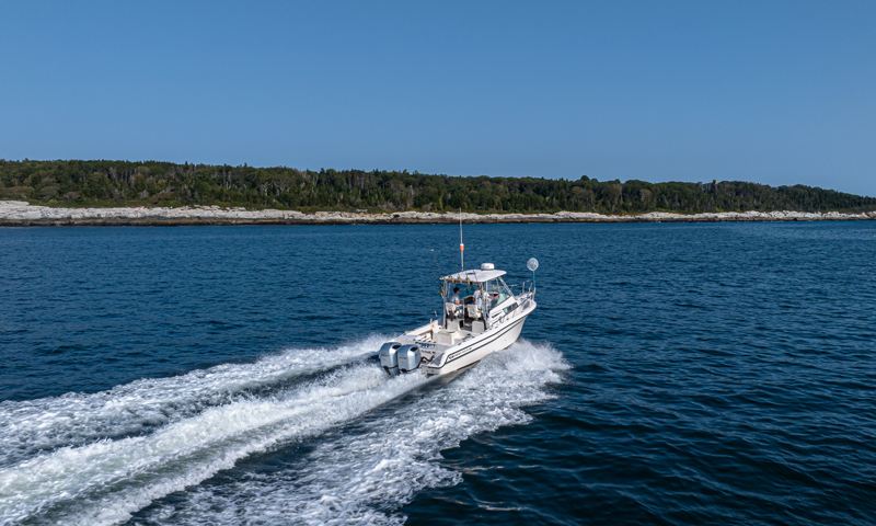 Fore River Sports Fishing cruising on water, Photo Credit: PGM Photography