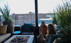 Women at Luna rooftop bar, Photo Credit: Lauren Peters at Visit Portland