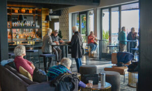 Group inside Luna rooftop bar, Photo Credit: Lauren Peters at Visit Portland