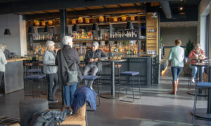 Group inside Luna rooftop bar, Photo Credit: Lauren Peters at Visit Portland