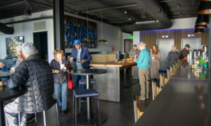 Group inside Luna rooftop bar, Photo Credit: Lauren Peters at Visit Portland
