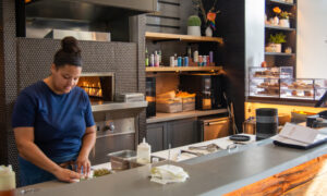 Making food at Canopy cafe, Photo Credit: Lauren Peters at Visit Portland