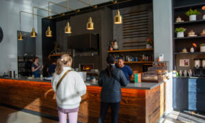 People buying food at Canopy cafe, Photo Credit: Lauren Peters at Visit Portland