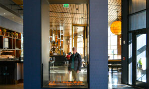 Man through Canopy fireplace, Photo Credit: Lauren Peters at Visit Portland