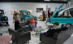 People sitting at Maine Classic Car Museum, Photo Credit: Lauren Peters at Visit Portland