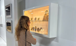 Person looking at vintage car exhibit, Photo Credit: Lauren Peters at Visit Portland