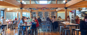 Dinning at Nonesuch Brewery, Photo Credit: Lauren Peters at Visit Portland